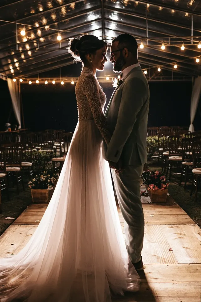 Couple at a candle-lit wedding hall